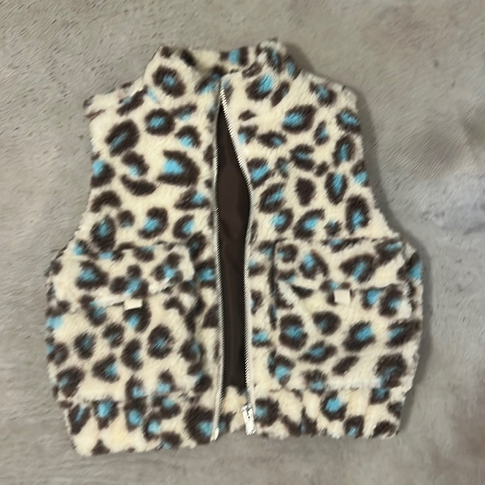 Blue and brown cheetah print fuzzy vest. Size small.